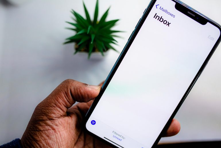 Smartphone displaying email inbox.