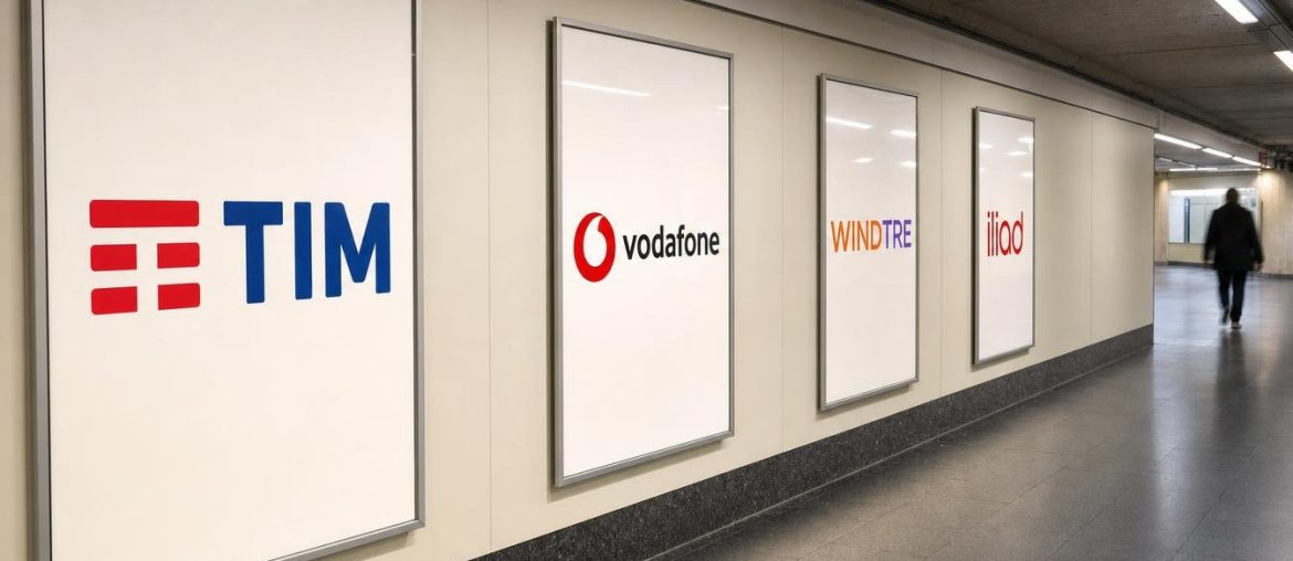 Deliverability SMS: cosa blocca i tuoi messaggi presso gli operatori Manifesti degli operatori mobili TIM, Vodafone, WindTre e Iliad in un corridoio della metropolitana